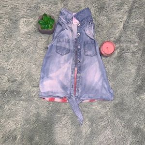 blue jean jacket, with american flag and dimonds on back.
